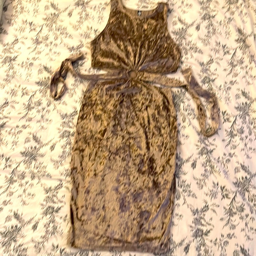 New no tags stretchy velvet sleeveless dress. cutout sides Quarter length.